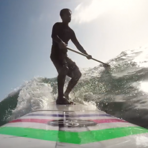 Infinity Surfboards shop-owner Dave Boehne takes local surfer Andrew Marriner out for a SUP surf sesh.
