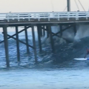 Laird Hamilton SUP surfing epic waves in Malibu!! Shoots the pier twice!!