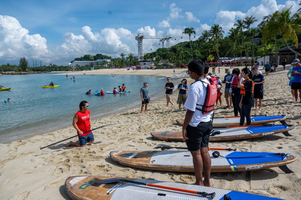 Coaches from SUPVentures teaching new participants on the
fundamentals for the SUP tryouts.