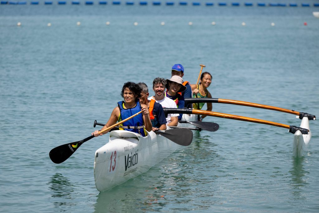 Participants went out for a spin on the six-man outrigger
canoe boats, led by volunteers from AustCham Paddle Club.